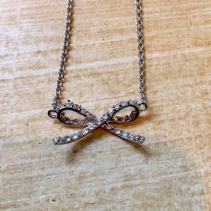 Silver and ‘diamond’ bow necklace